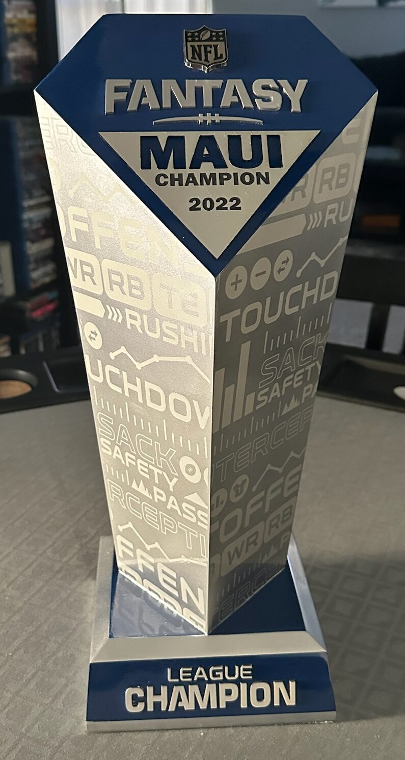 NFL Fantasy Football league champion trophy with custom engraved team name and year, silver and blue column design, Las Vegas