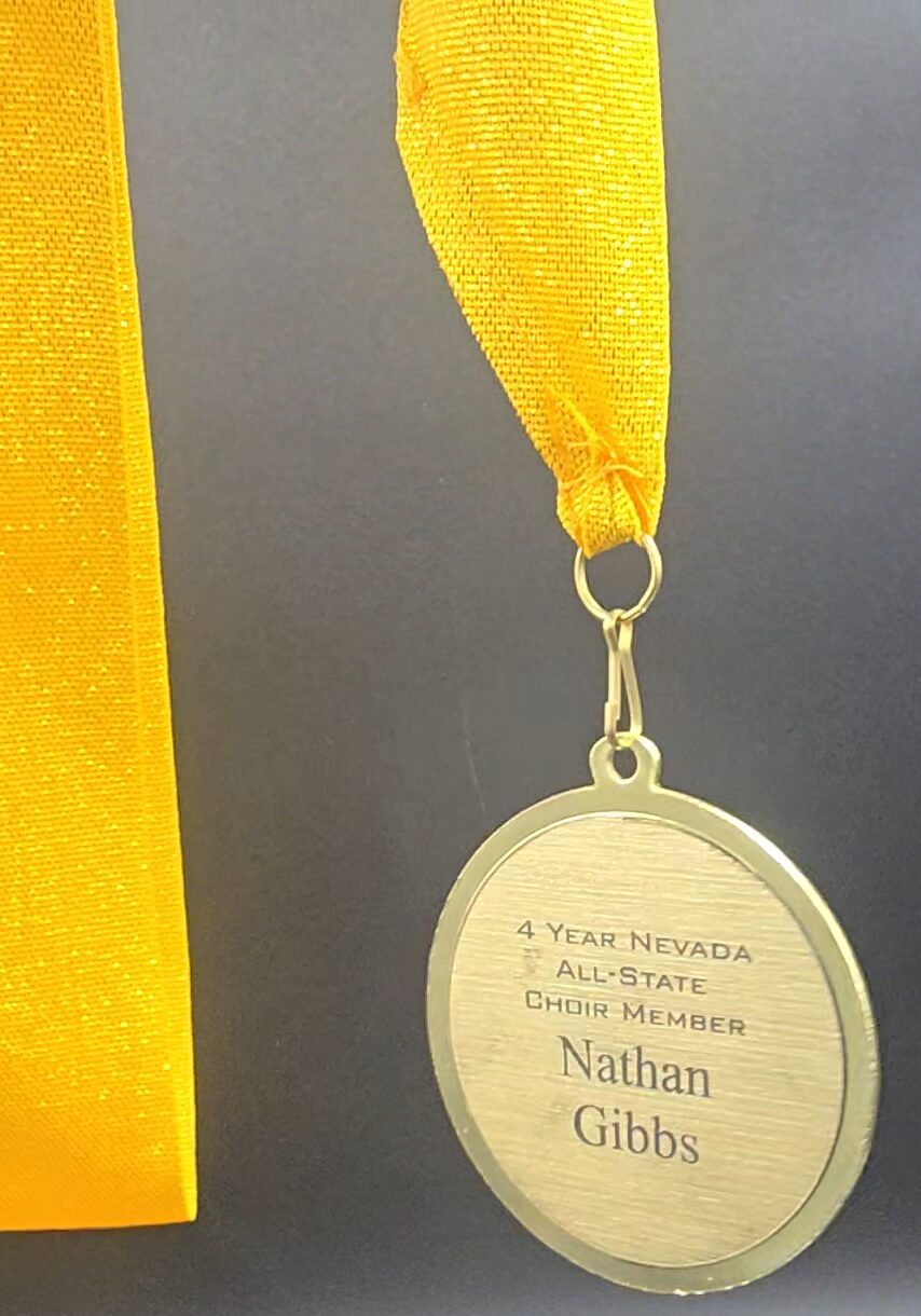 Gold medal with yellow ribbon laser-engraved for Nevada All-State Choir Member, custom personalized award, Las Vegas