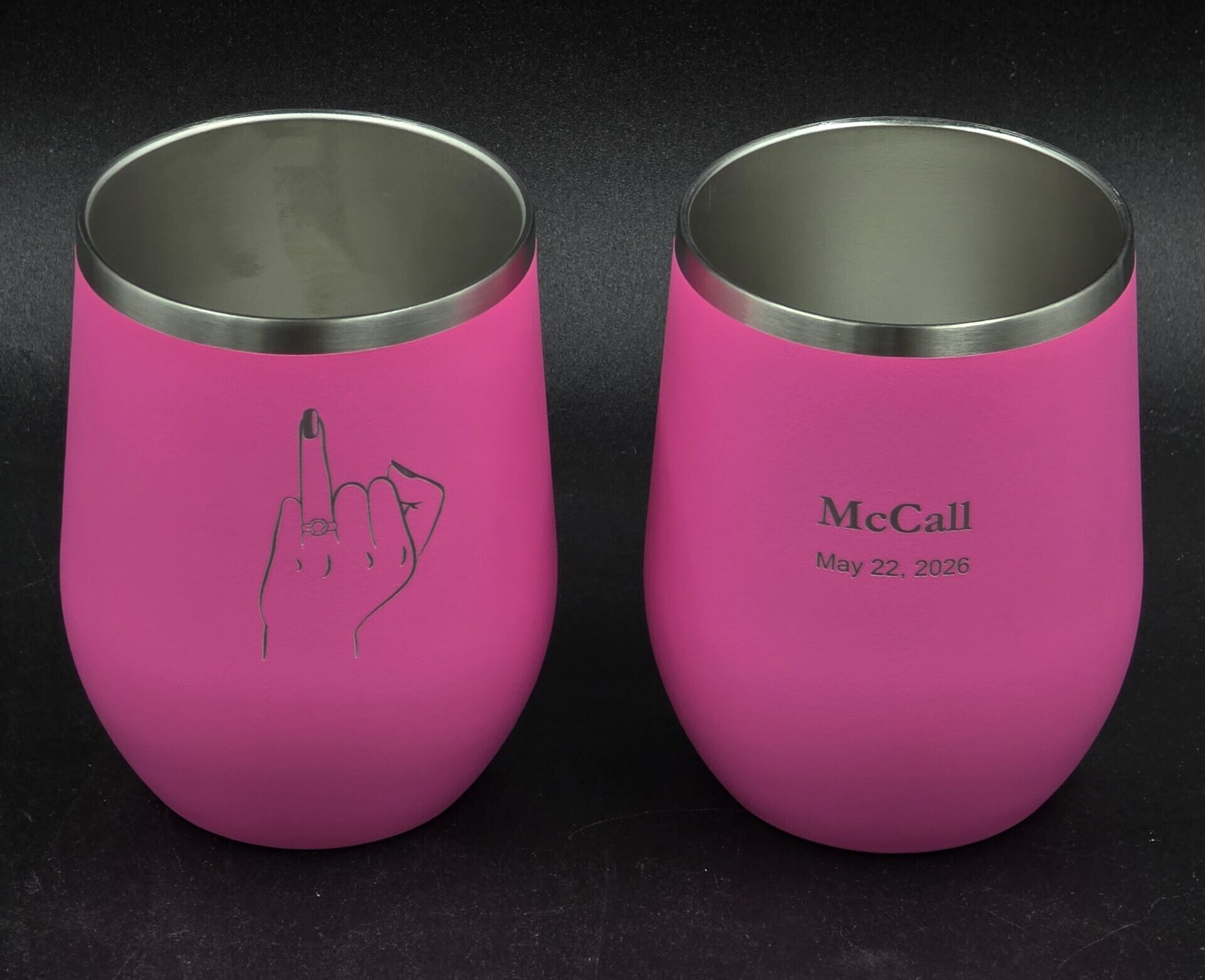 Custom laser-engraved pink stainless steel stemless wine tumblers with personalized name and date, Las Vegas